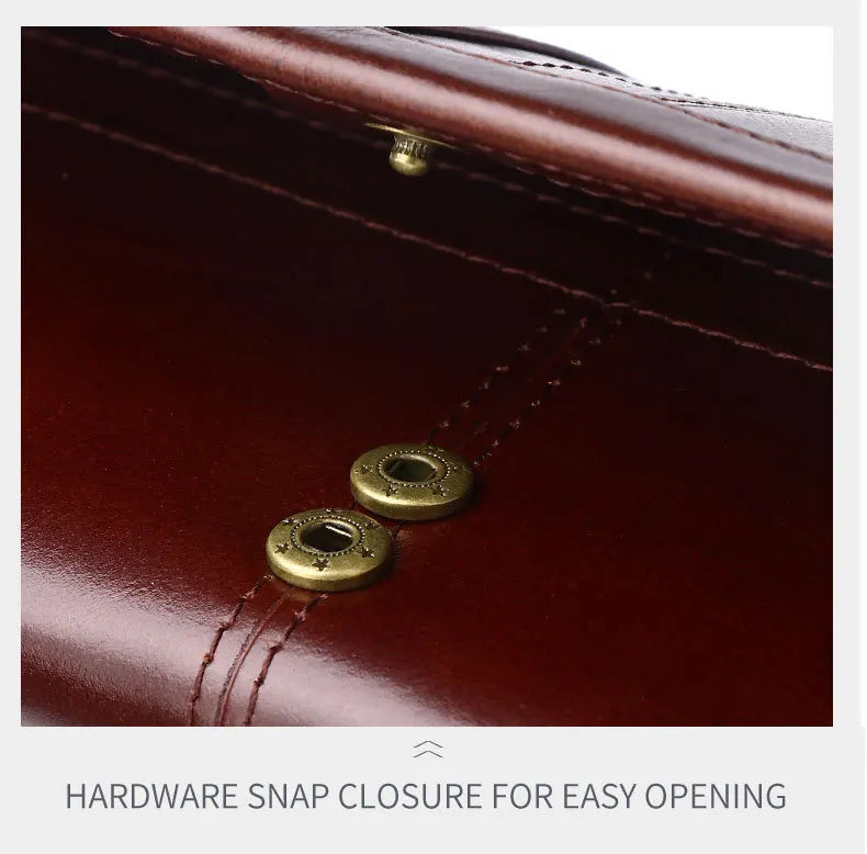 Close-up of a brown leather bag with gold hardware snap closure