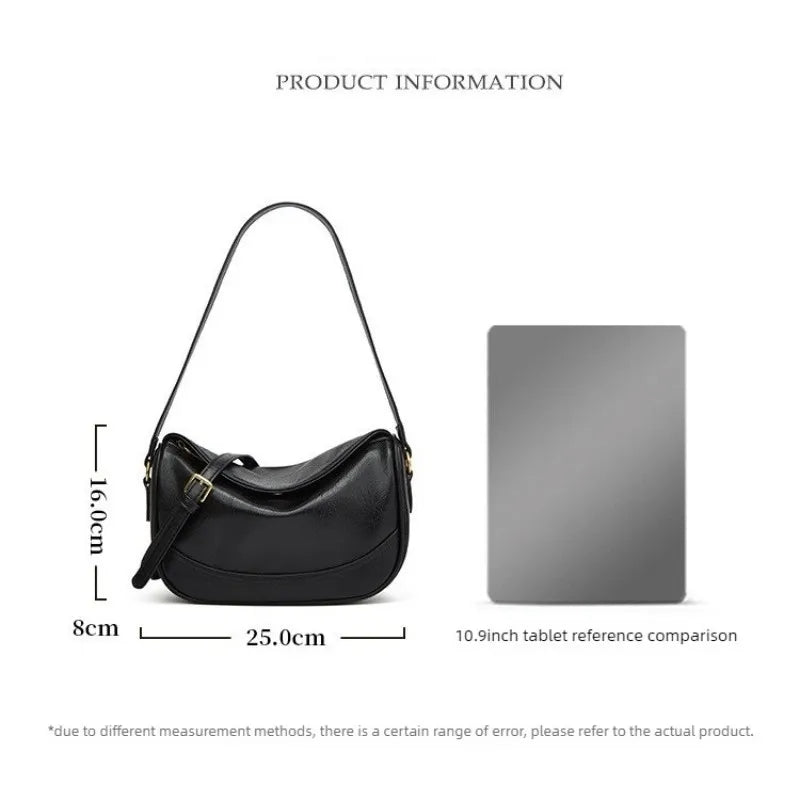 Minimalist crescent hobo shoulder bag in neutral tones styled as a quiet luxury accessory by The PM Edit.