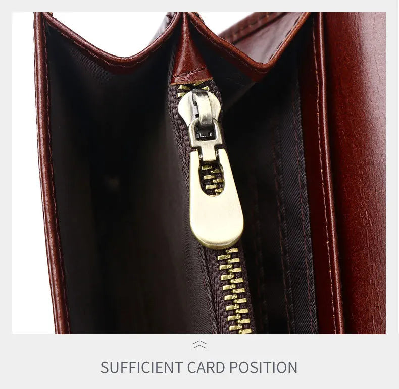 Close-up of a brown leather bag with a gold zipper on a white background