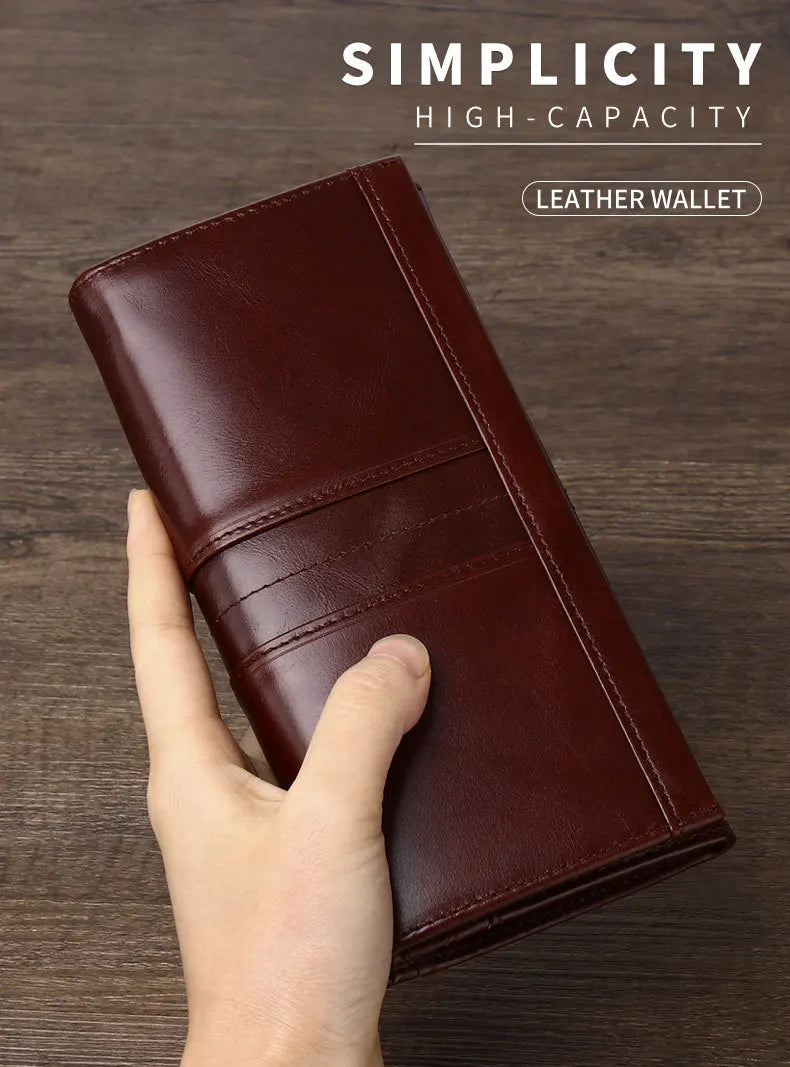 Brown leather wallet held by a hand on a wooden surface with 'Simplicity High-Capacity Leather Wallet' text.