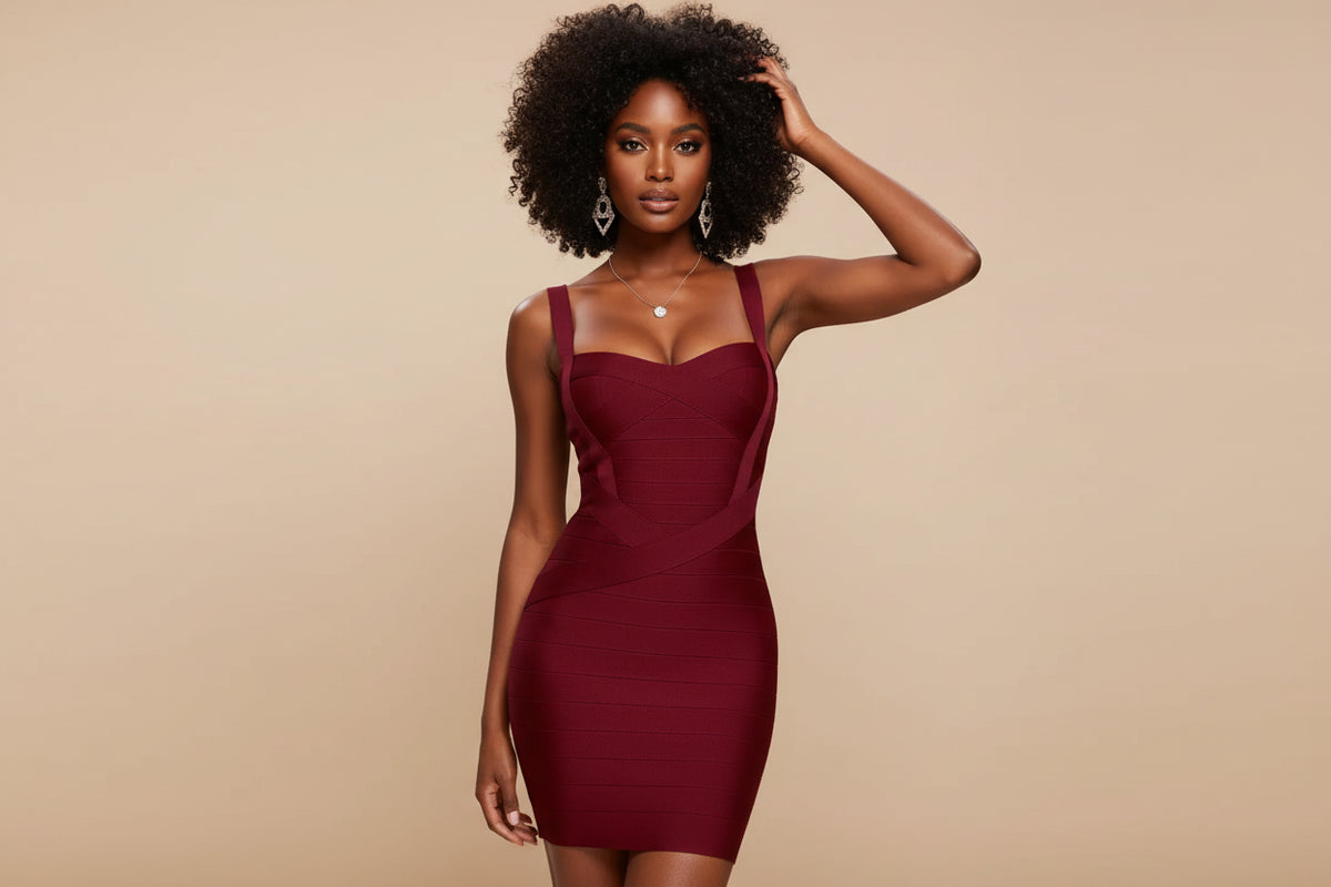 Woman wearing a burgundy dress against a beige background
