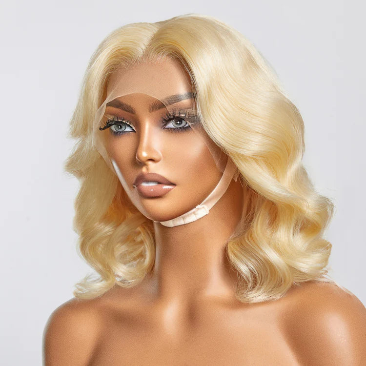 Mannequin head with blonde wig on a plain background