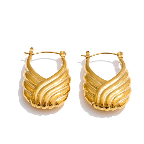 Gold hoop earrings on a white background