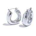 Pair of silver hoop earrings on a white background
