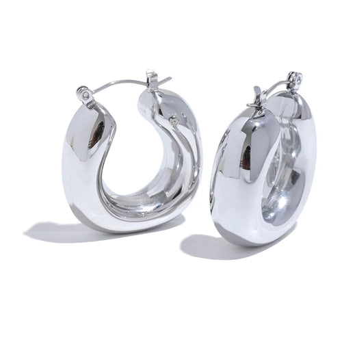 Pair of silver hoop earrings on a white background