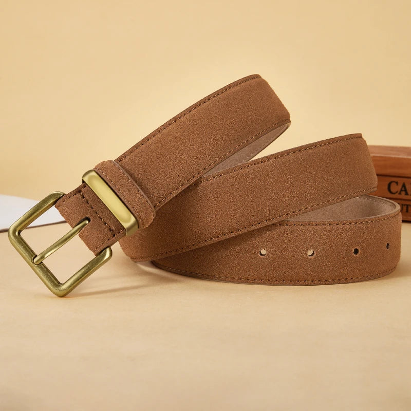 Brown suede belt with a gold buckle on a beige background