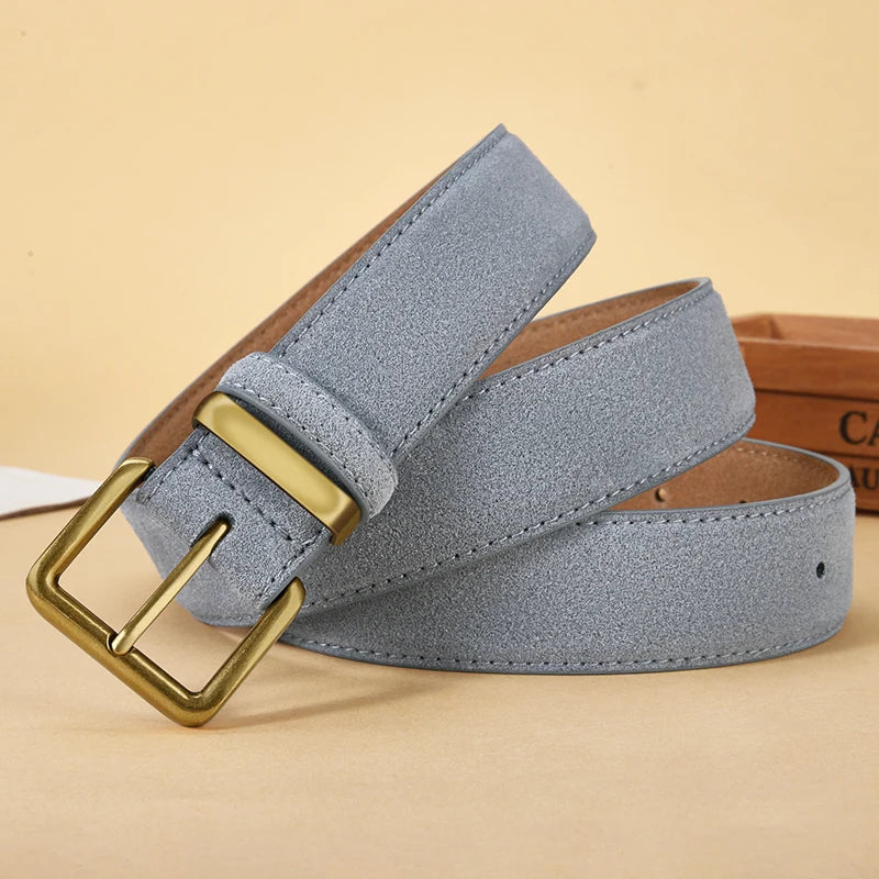 Gray belt with a gold buckle on a beige background