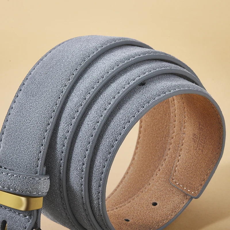 Gray suede belt with a gold buckle on a beige background