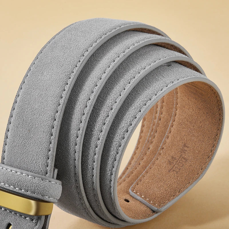 Gray suede belt with a gold buckle on a beige background