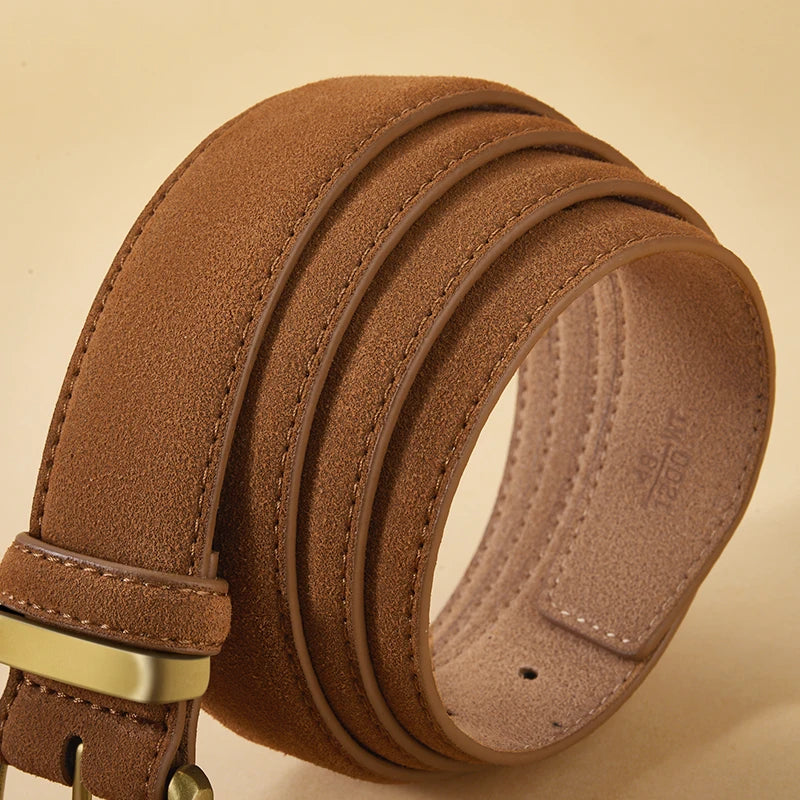 Brown leather belt with a gold buckle on a beige background