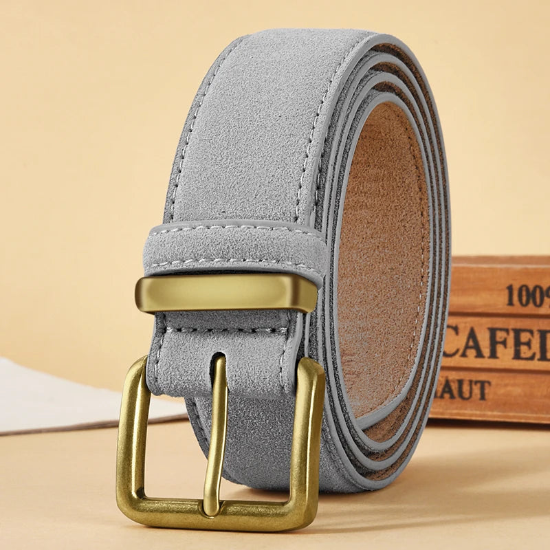 Gray suede belt with gold buckle on a beige background