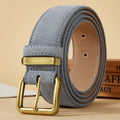Gray suede belt with a gold buckle on a beige background