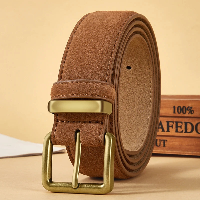 Brown leather belt with gold buckle on a beige background