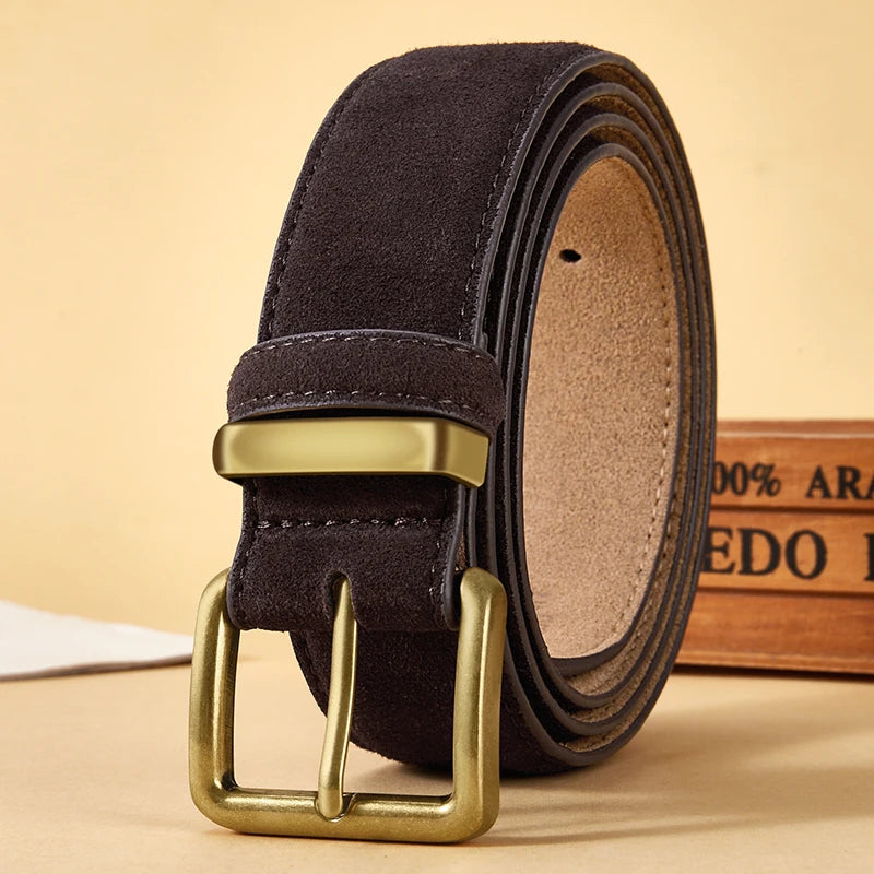 Dark brown suede belt with gold buckle on a beige background