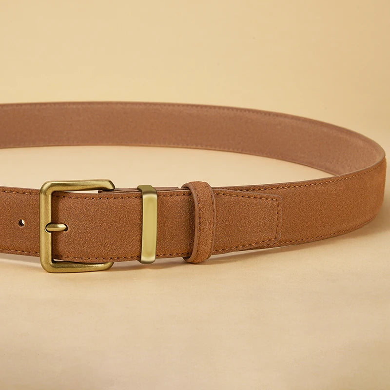 Brown belt with a gold buckle on a beige background