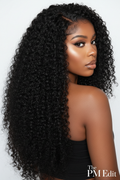 Woman with long, curly black hair against a white background