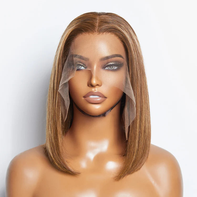 Mannequin head with a brown wig on a white background