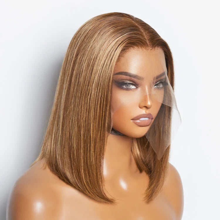 Mannequin head with a brown wig on a white background