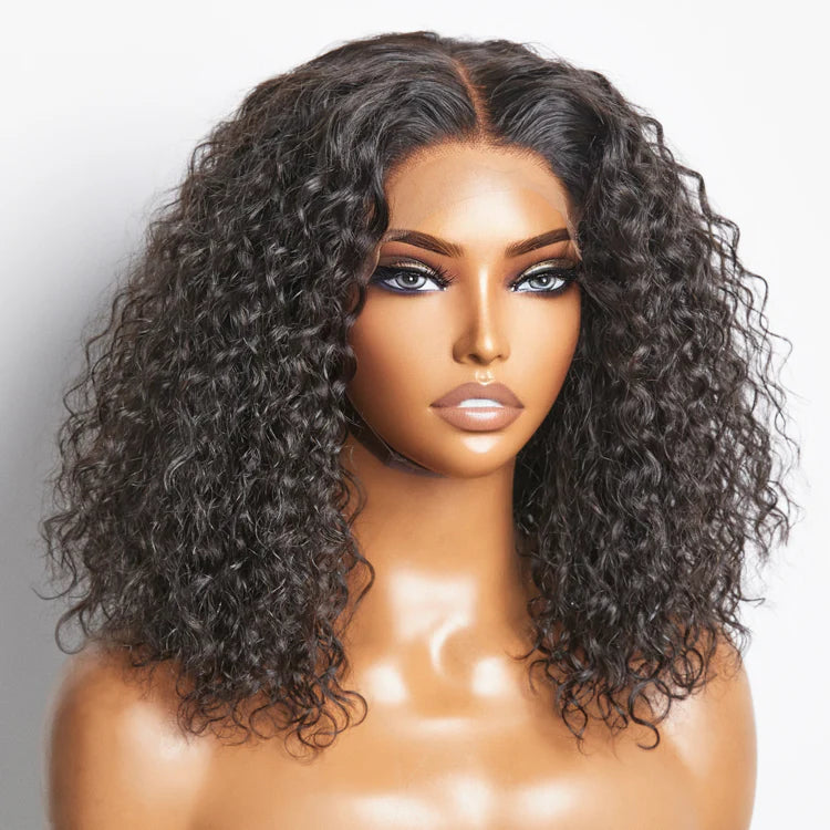 Mannequin head with a black curly wig on a white background