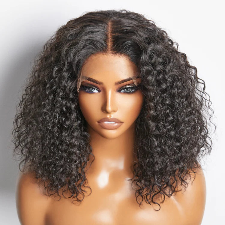 Mannequin head with a curly black wig on a white background.