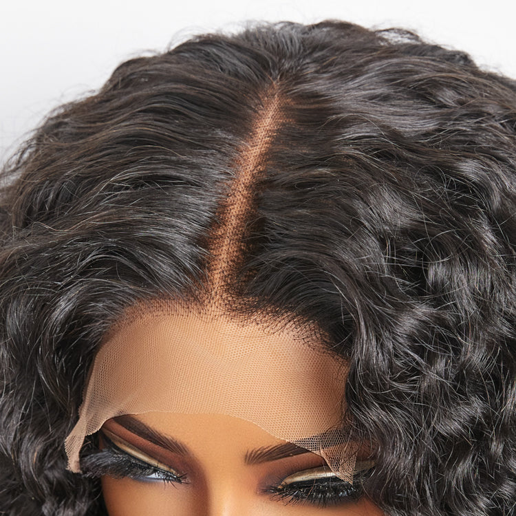 Close-up of a wig with a lace front and styled hair on a white background