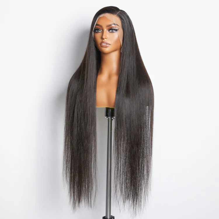 Mannequin head with long straight black wig on a white background