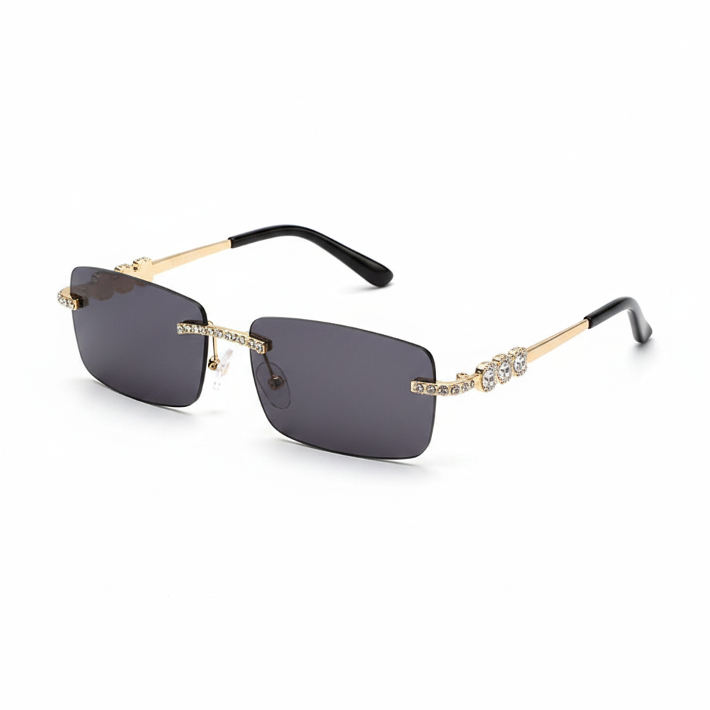 Rimless square sunglasses with dark gray lenses, gold metal frames accented with clear rhinestones, and black temple tips, shown on a white background.