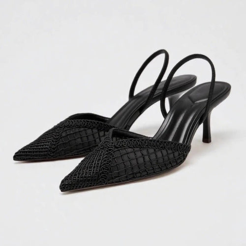 Black woven high-heeled shoes on a light gray background