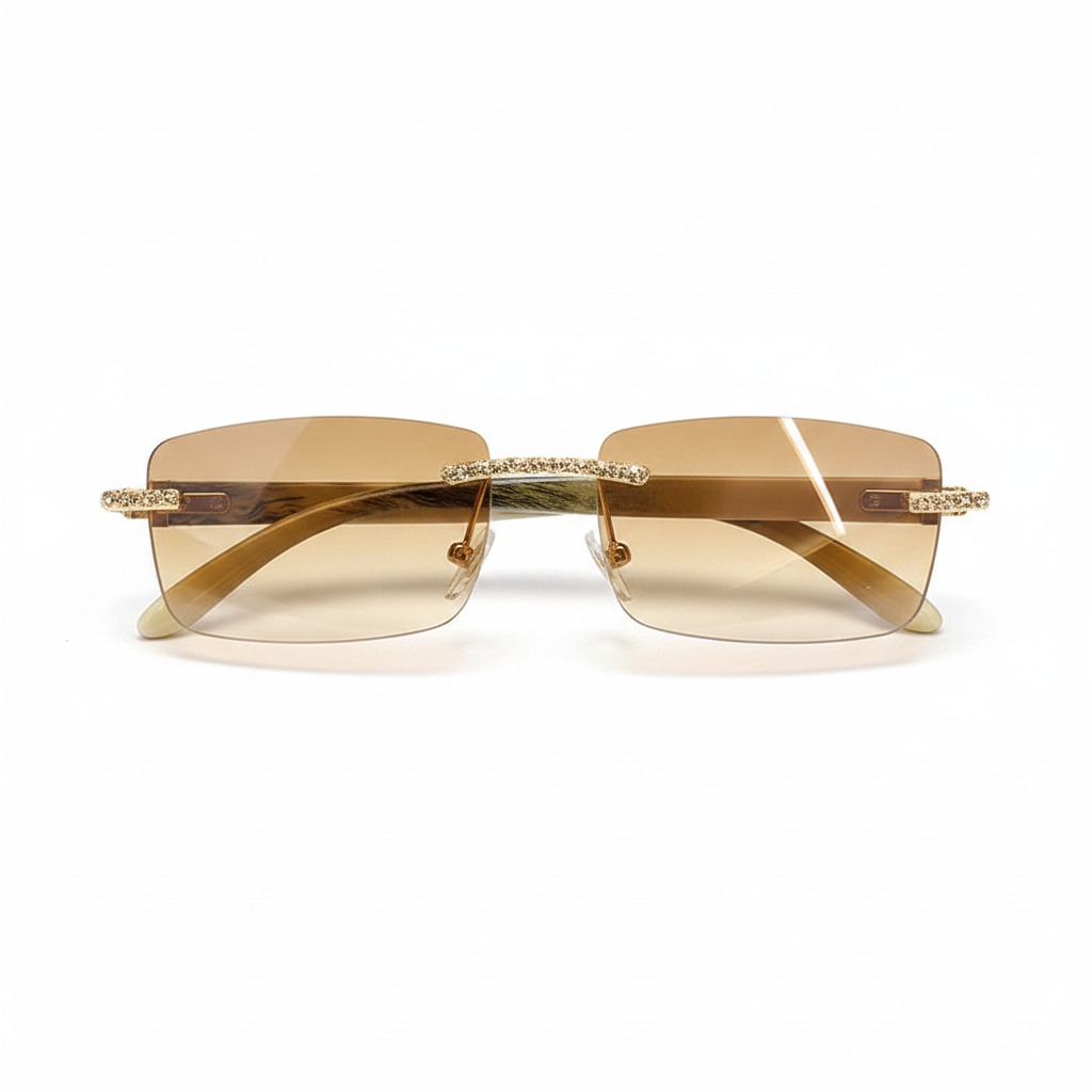 Rimless square sunglasses with light brown tinted lenses and gold metal frames adorned with small clear rhinestones, shown against a plain white background.