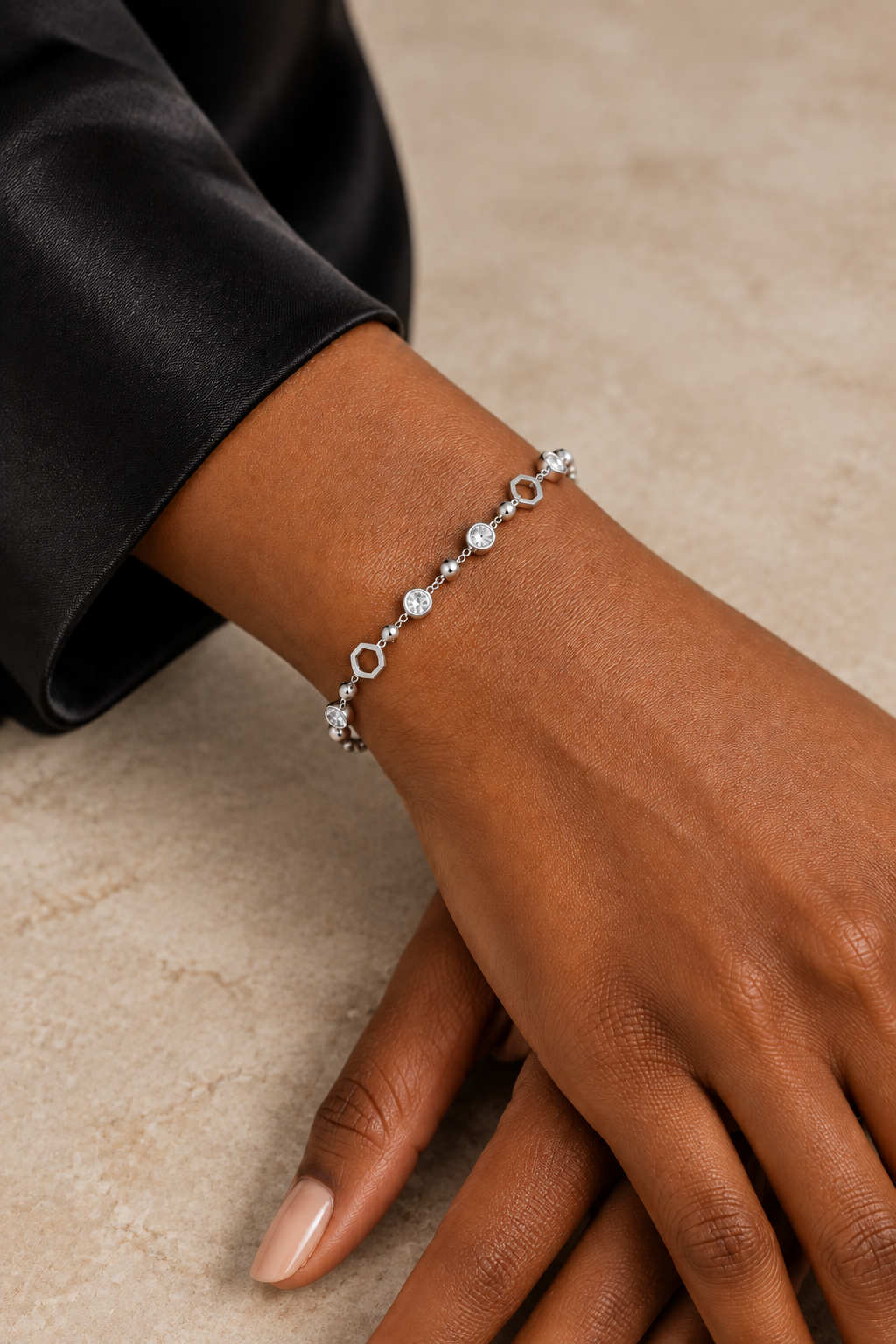 Bracelet on wrist at a tabletop