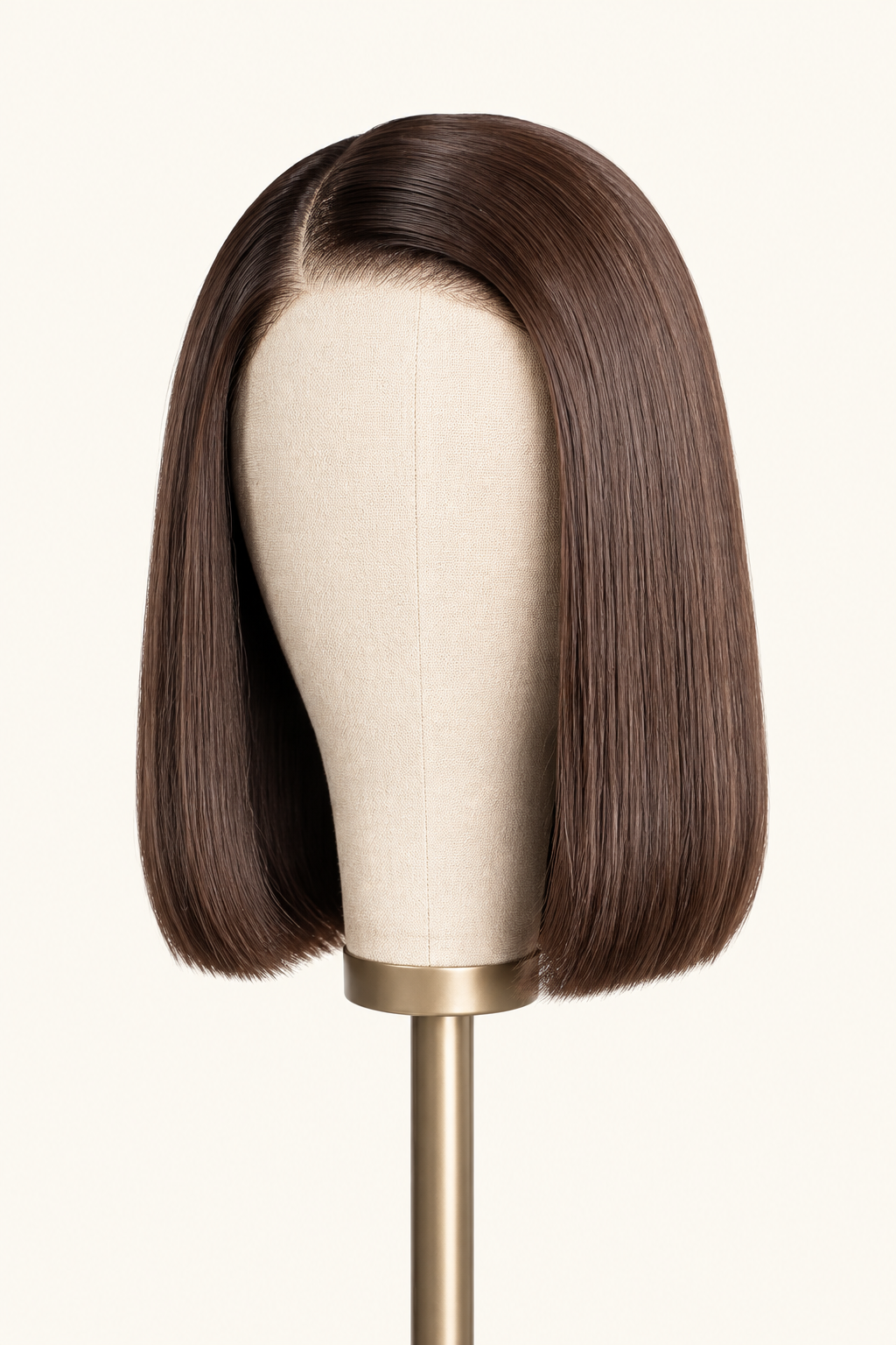 Front portrait view of a short ten inch number four chocolate brown straight human hair bob wig with a sharp center part by The PM Edit.
