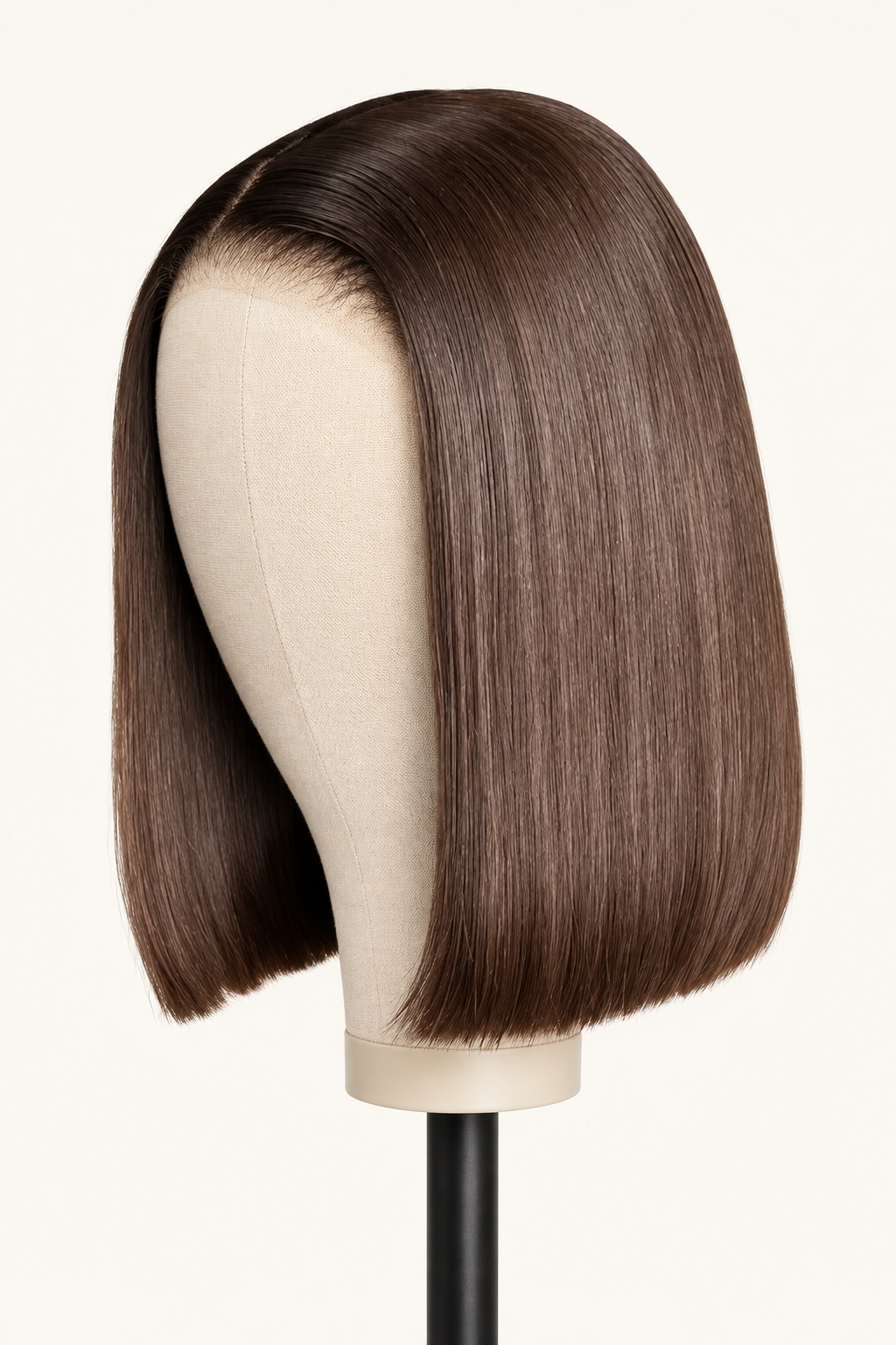 Front portrait view of a short ten inch number four chocolate brown straight human hair bob wig with a sharp center part by The PM Edit.