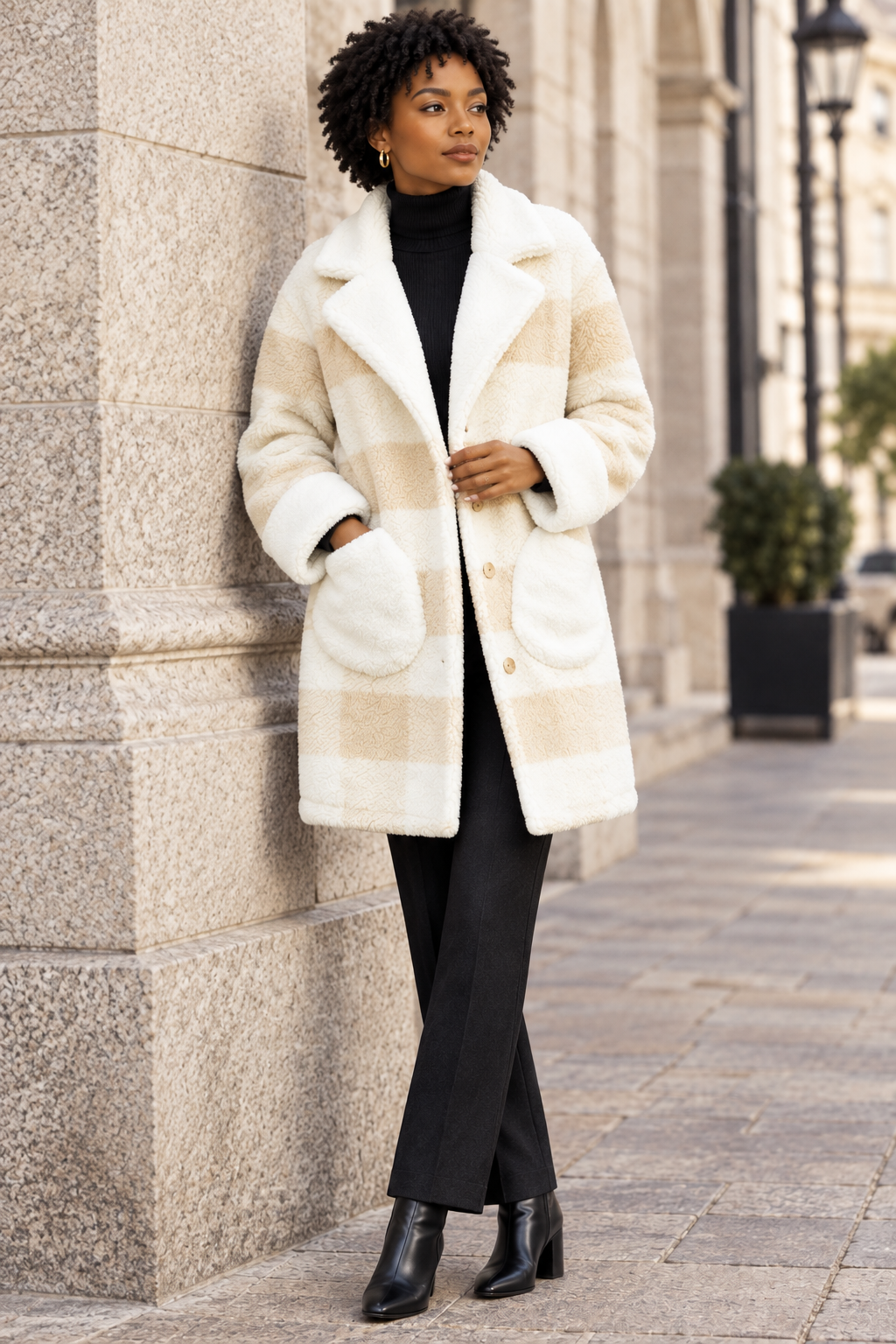 Coat lifestyle image, by the stone wall