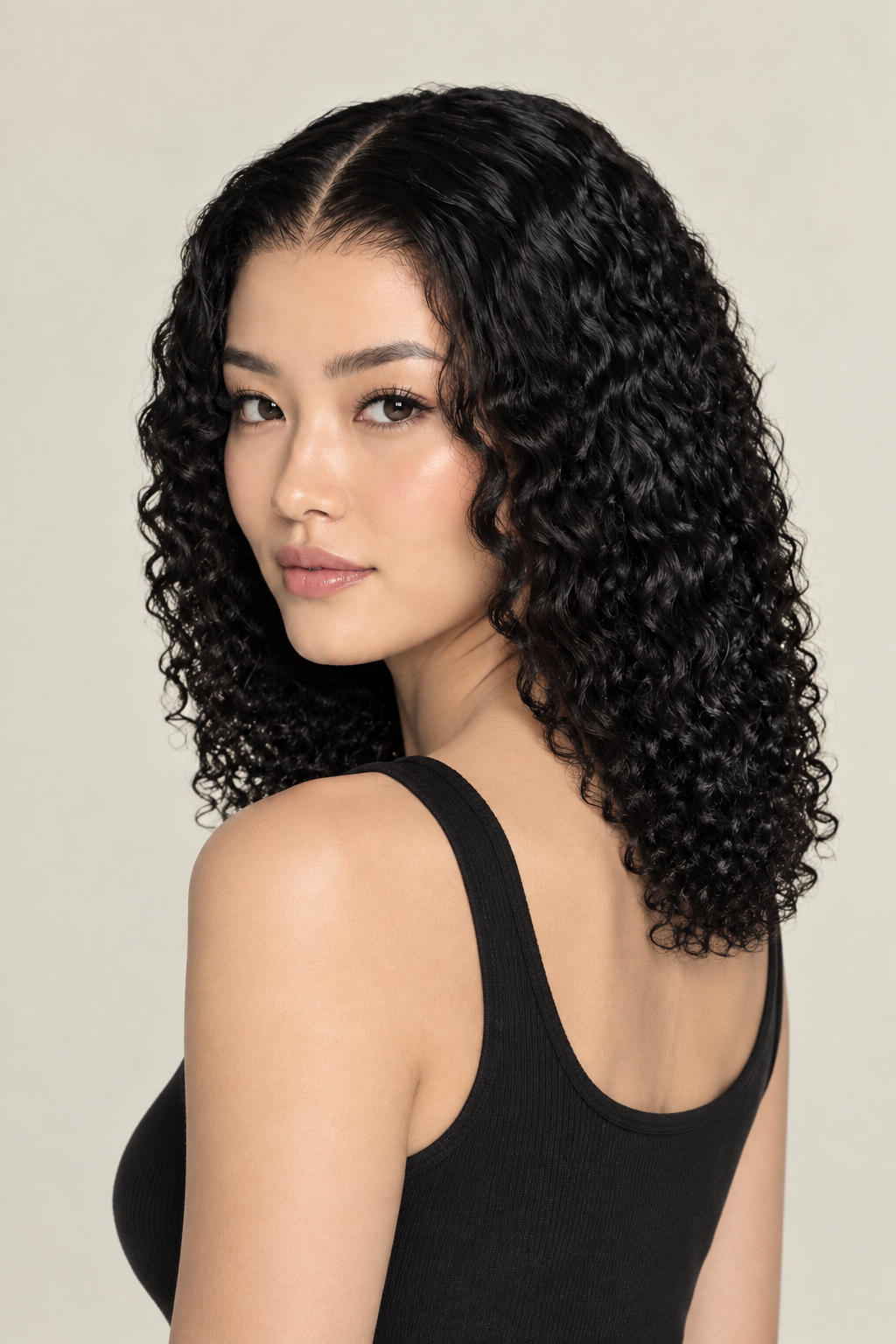 Corrected curly-wave wig on model, back three-quarter view