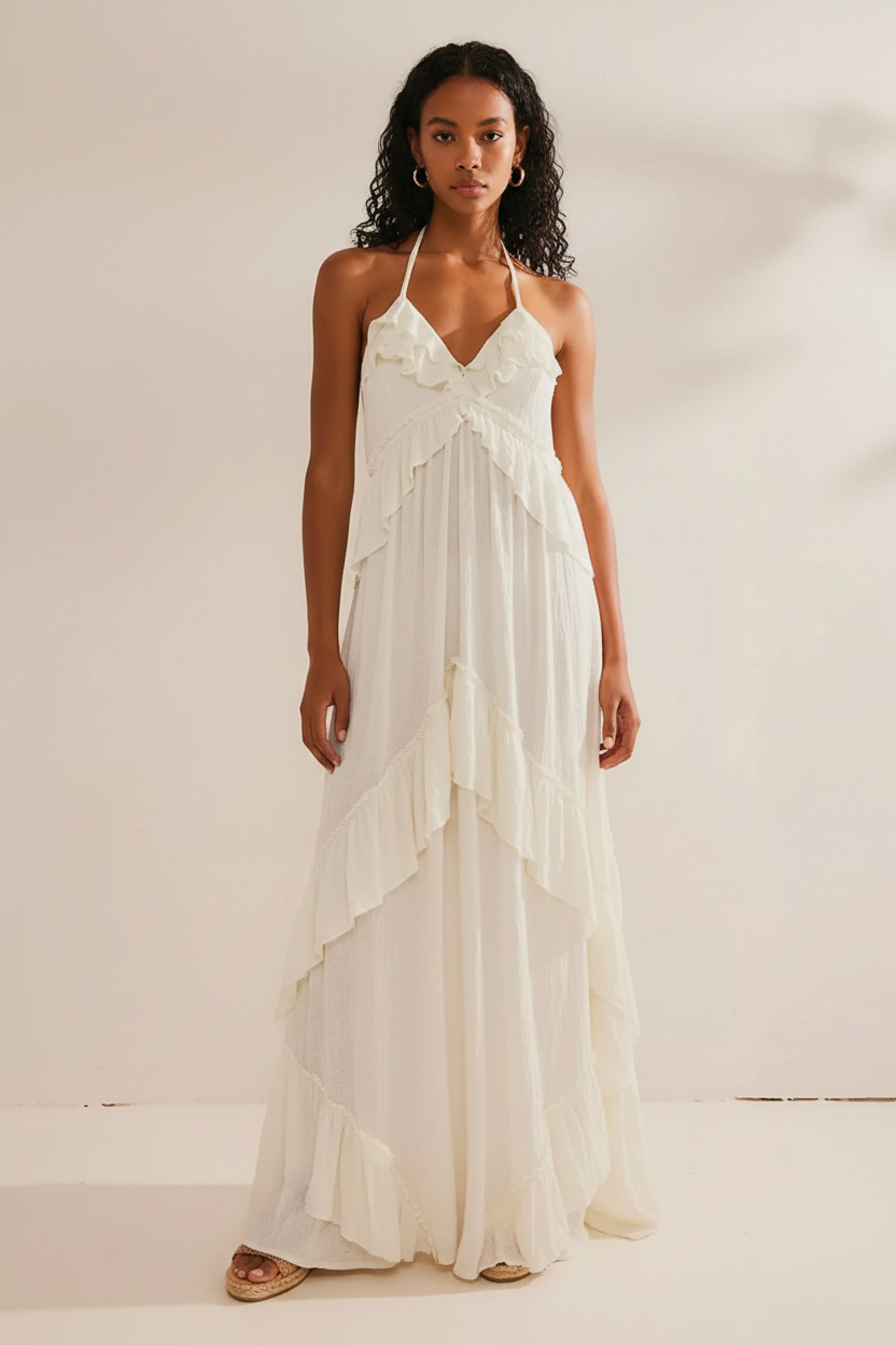 White ruffled halter-neck maxi dress worn by a model
