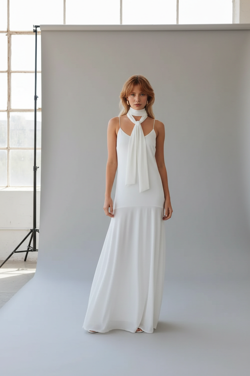 Model wearing the white adjustable-strap maxi cami dress with its matching short scarf