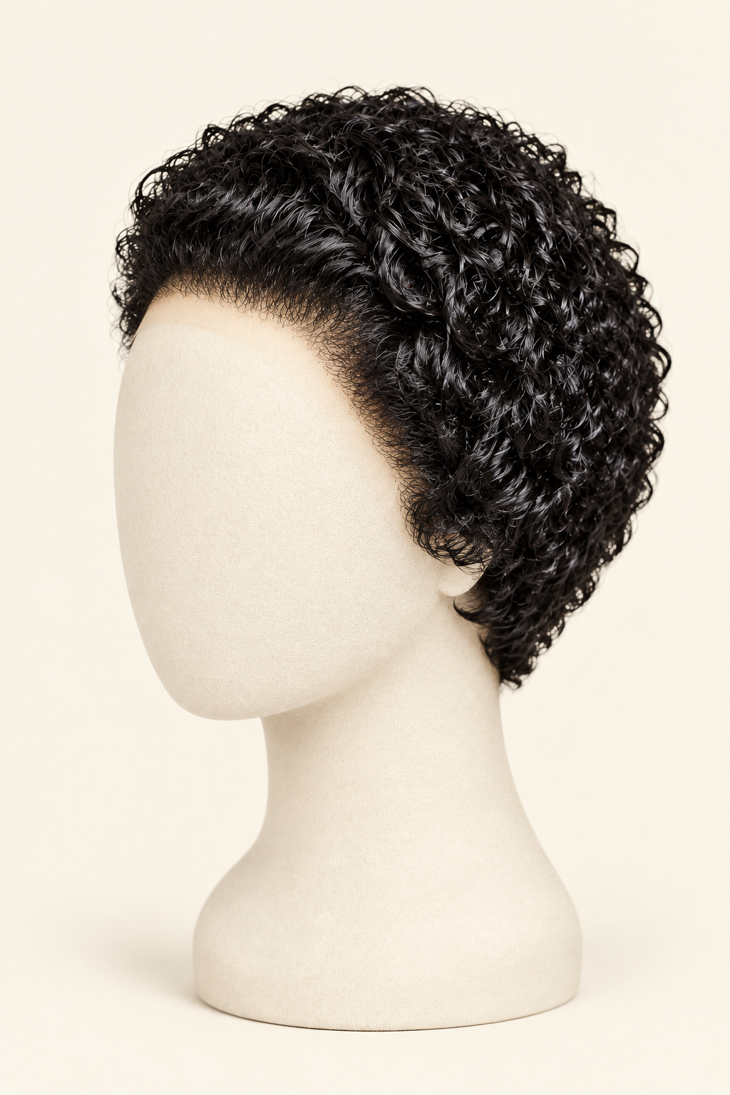 Short curly black wig displayed on a cream mannequin head against a light beige background.