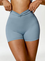 Load image into Gallery viewer, Twisted High Waist Active Shorts with Pockets
